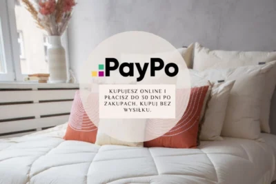 Kołdry i poduszki Eurowolle leżące na łóżku. Na zdjęciu Informacja o płatności PayPo