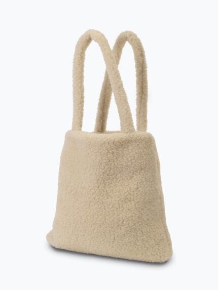 Jasna torba z wełny z długimi uchwytami na neutralnym tle